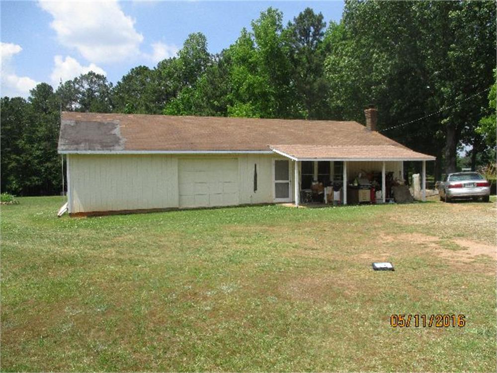 Historical county-record exterior photo of the home at 614 Bay Springs Road, dated May 11, 2016.